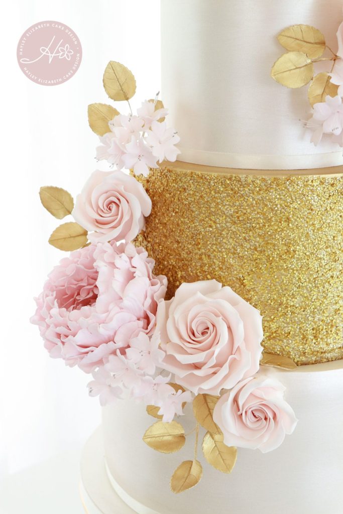 Luxury wedding cake from Hayley Elizabeth Cake Design, Dorset and Hampshire cake designer. Gold and blush wedding cake, gold sequin wedding cake, sugar flowers, white gold pink wedding cake, white and gold wedding cake, elegant wedding cake, wedding cake ideas.