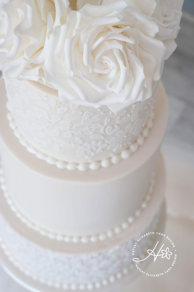 All white wedding cake from Hayley Elizabeth Cake Design, luxury wedding cake, elegant wedding cake, sugar flowers, wedding cake inspiration, Hampshire wedding cake design, cake art, Dorset cake design, wedding planning
