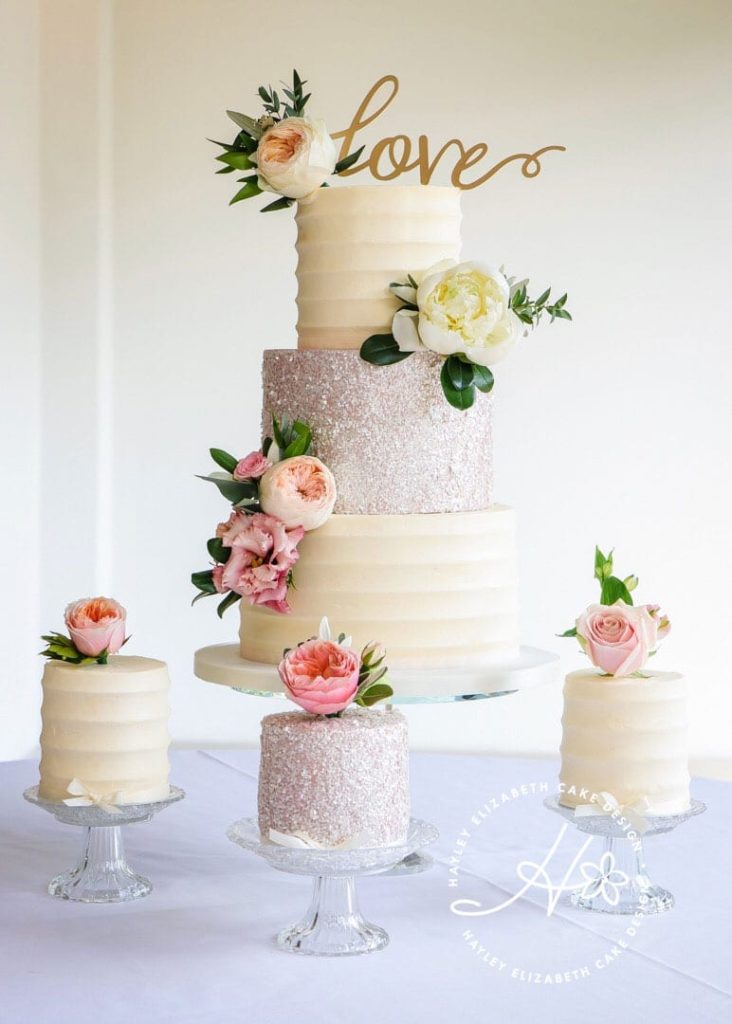 Luxury wedding cake by Hayley Elizabeth cake design, Hampshire and Dorset. Elegant wedding cake, shimmer wedding cake, sequin wedding cake, fondant icing, fresh flowers, elegant wedding cake, wedding cake inspiration